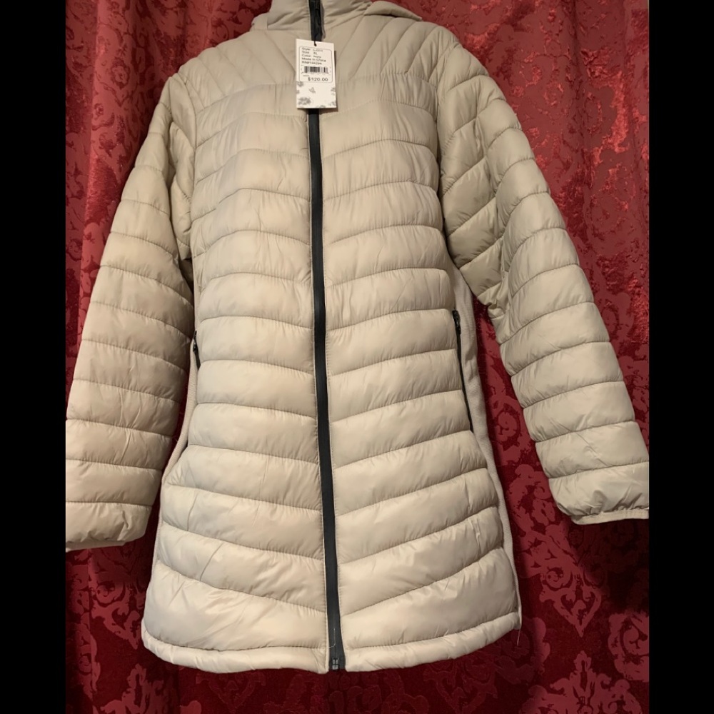 Woman’s down like long puffer jacket with hoodie.